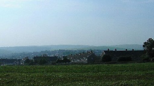 Woodingdean. Taken from the bridlepath to the east of the built up area looking west. The backs of the houses of Sherrington Road are top right, Bexhill Drive to the left. The rest of Woodingdean can be seen in the dip in the downs. In the distant haze the shape of St Dunstans can be made out.