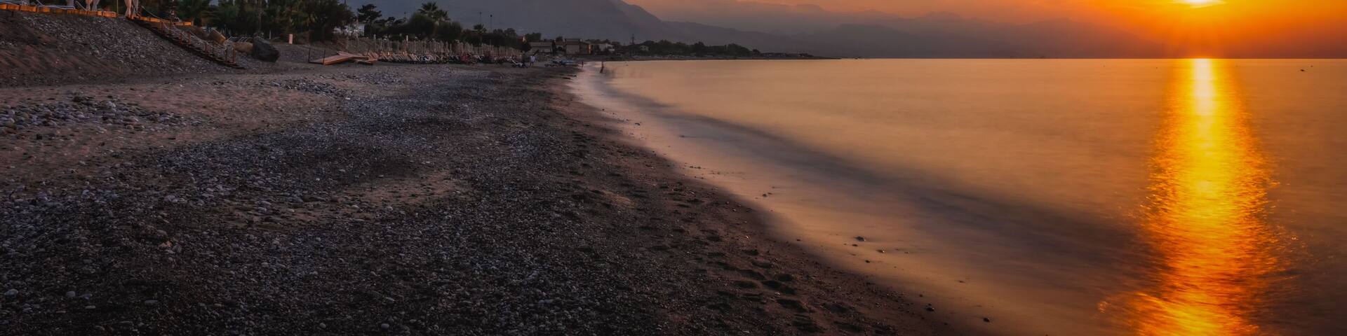 Sunset on the beach of the city of Campofelice di Rosaria in northwestern Sicily. August 2024