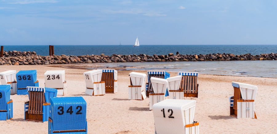 Wicker beach chairs at the beach with sunny weather