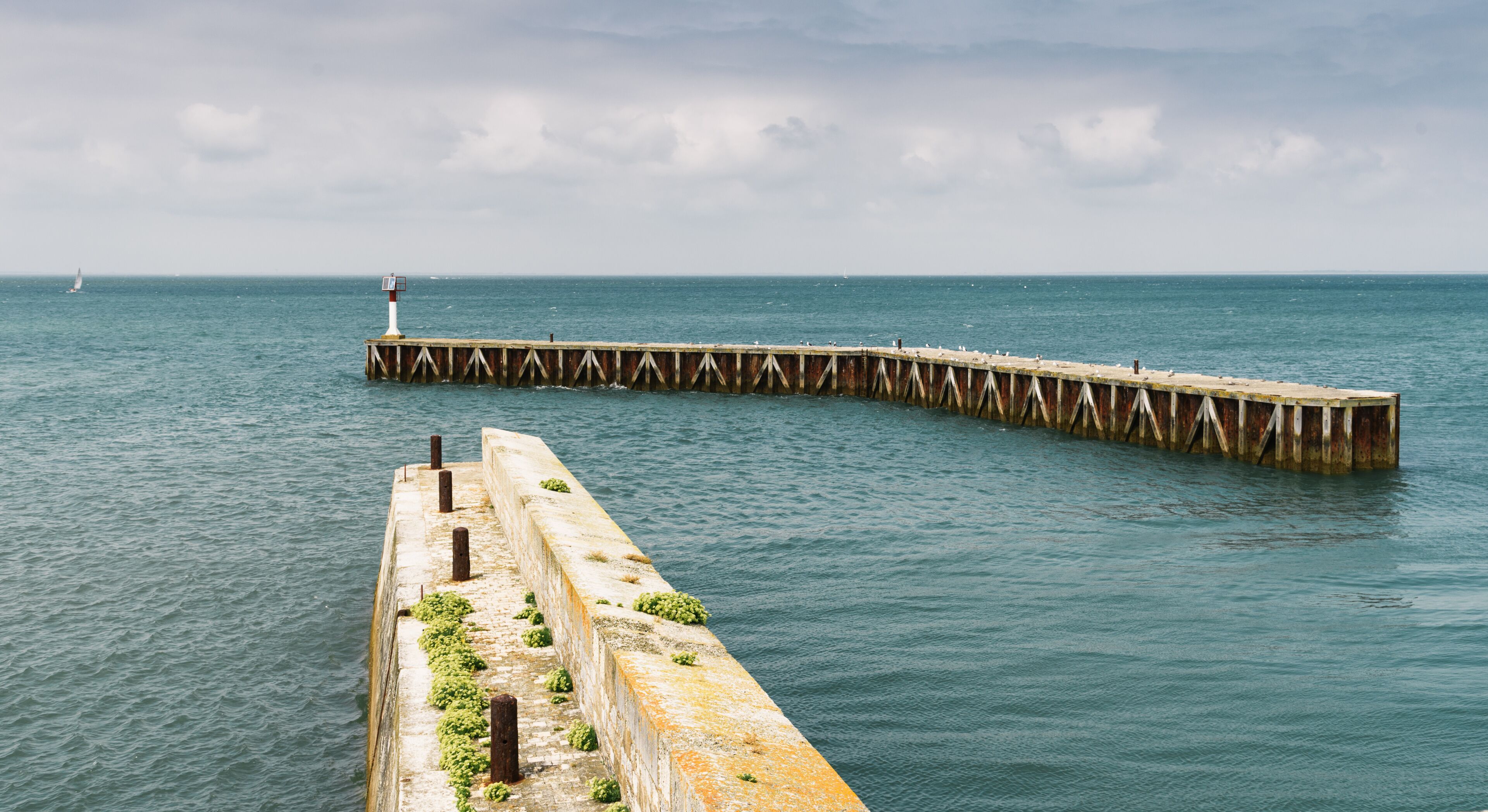 Pier in the entrance to the port of Saint Martin de Re in the Island of Re