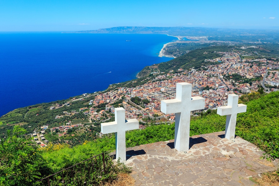 Summer picturesque Tyrrhenian sea Calabrian coast view from Monte Sant'Elia (Saint Elia mount, Calabria, Italy) top. Three Christianity crosses on mountain top.