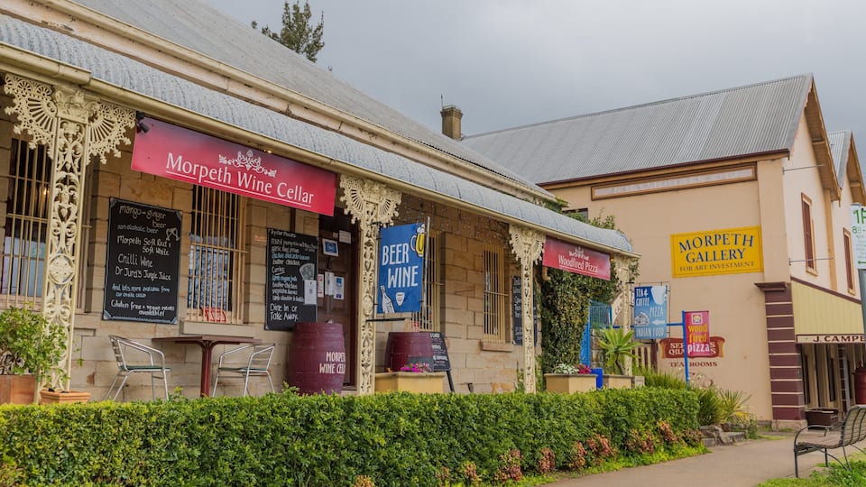 Morpeth which includes signage and a small town or village