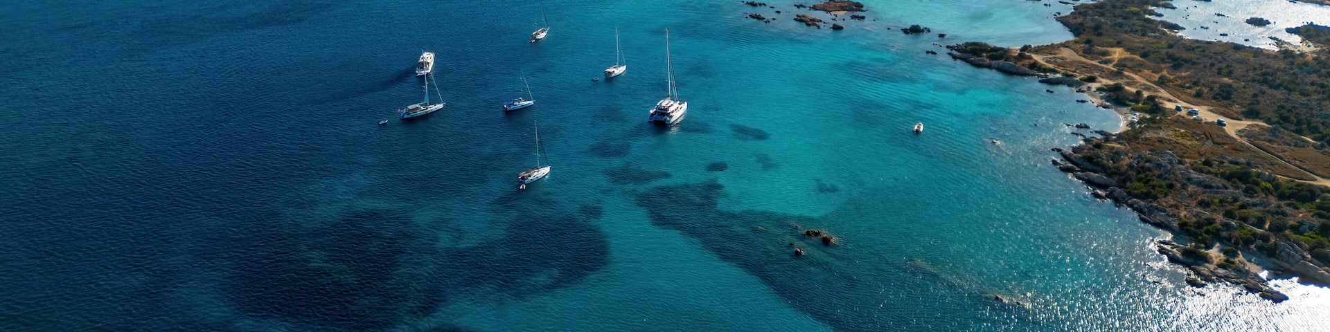 Aerial view of Capocchia d'u purpu beach (Testa del Polpo) and its iconic granite rock on Giardinelli island in La Maddalena archipelago, Sardinia, Italy