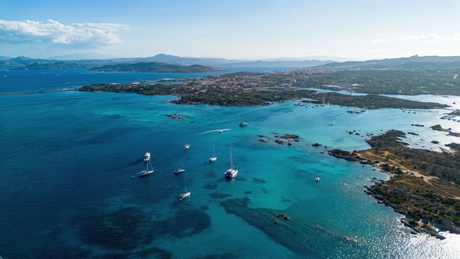 Aerial view of Capocchia d'u purpu beach (Testa del Polpo) and its iconic granite rock on Giardinelli island in La Maddalena archipelago, Sardinia, Italy