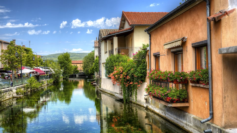 La Sorgue running through the City of L'Isle-sur-la-Sorgue, Provence, France, Shutterstock ID 557507626, Purchase Order: -