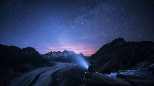 This photo is a bit of special #adventure memory for me, as I took this photo the night after my birthday. While I was getting old, and thinking how small we are compared to the infinite time and scale of the universe, the glacier was saying it out loud with a rocking sound of cracking ice. Aletsch glacier - the longest glacier in the alps, but it shrinks every year, and it might disappear one day. I could have easily stayed there the whole night, but I had to go, as in the morning I had to run half marathon up and along the slopes of the glacier again.