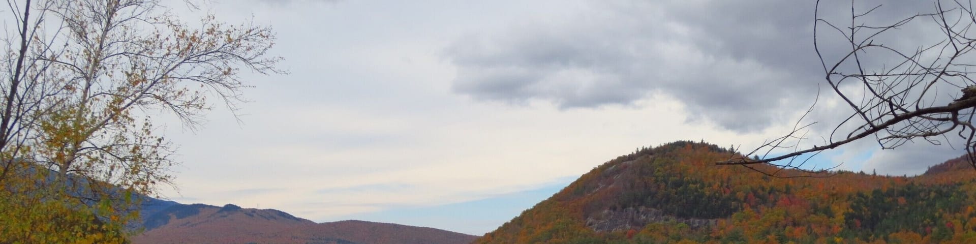 A completely reflective body of water produces awesome photos, even if the sky isn't blue. Autumn in Northern New England is a truly awesome time of year!