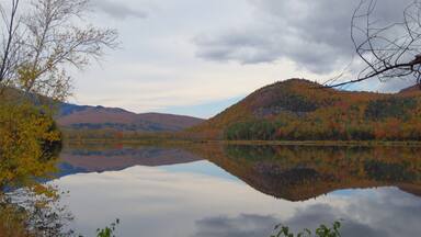 A completely reflective body of water produces awesome photos, even if the sky isn't blue. Autumn in Northern New England is a truly awesome time of year!