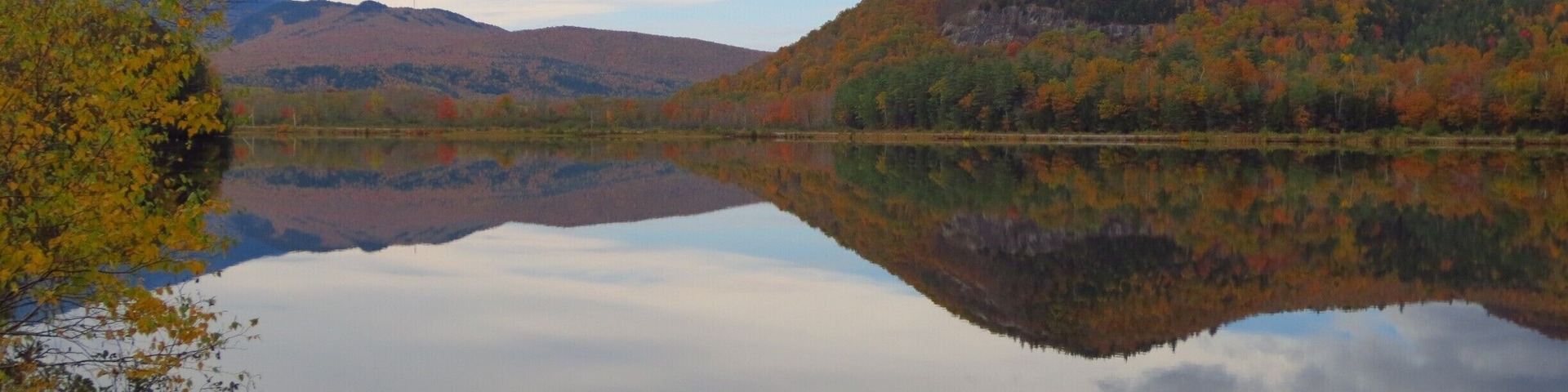 A completely reflective body of water produces awesome photos, even if the sky isn't blue. Autumn in Northern New England is a truly awesome time of year!