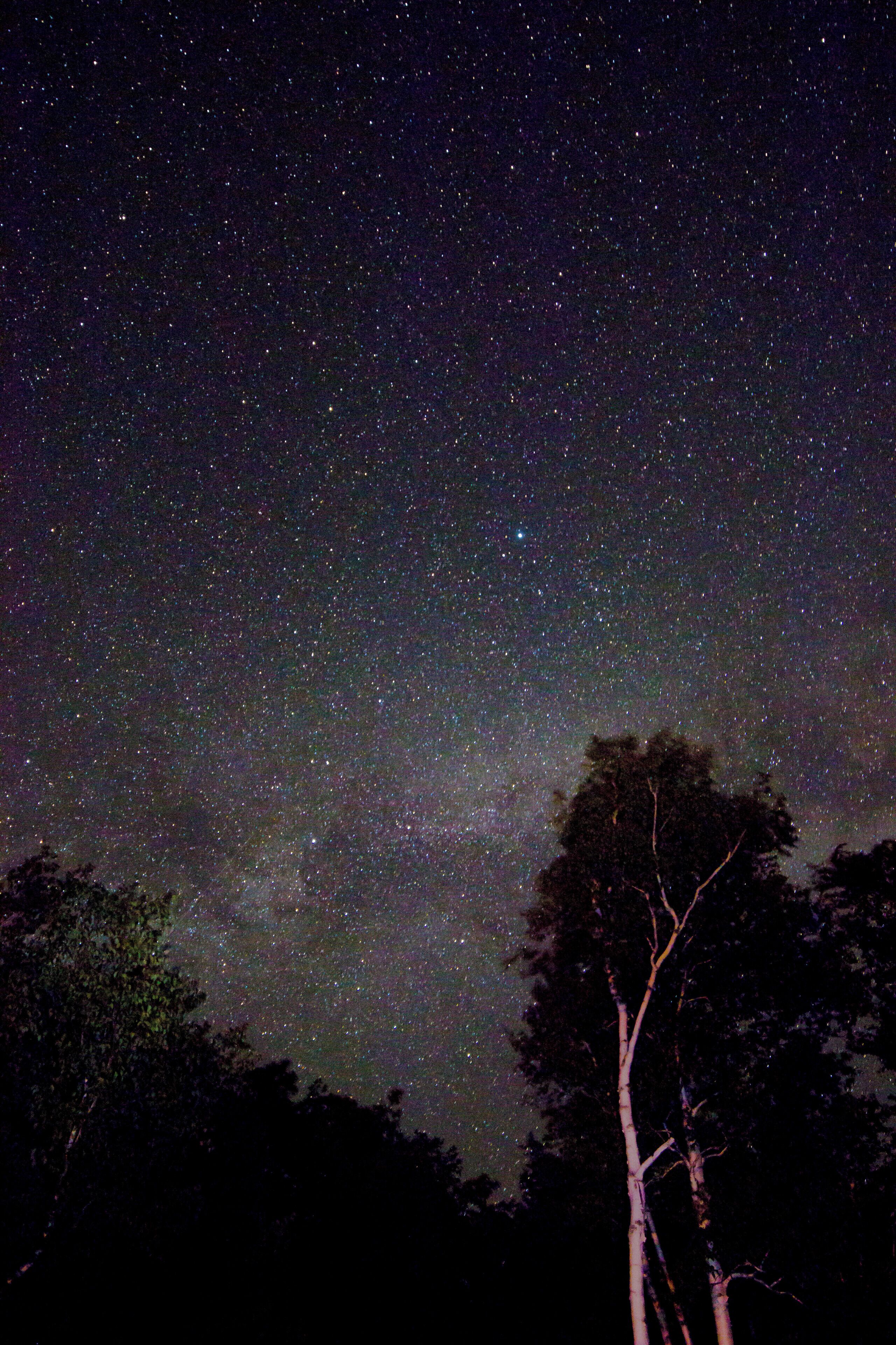 The north country of NH is one of the better places to do star photography east of the Mississippi River.  I took this picture right outside the campground along US Rt 2 at an abandoned rest stop.  I cannot say enough good things about Timberland Campground . . . . owners are wonderful and it's a nice quiet place to camp.
Technical info:
Camera: Canon 80D
Lens: Rokinon 14mm f/2.8
ISO: 1000
Shutter: 25 seconds
Aperture: f/2.8
Facing Northeast on June 15 about midnight.