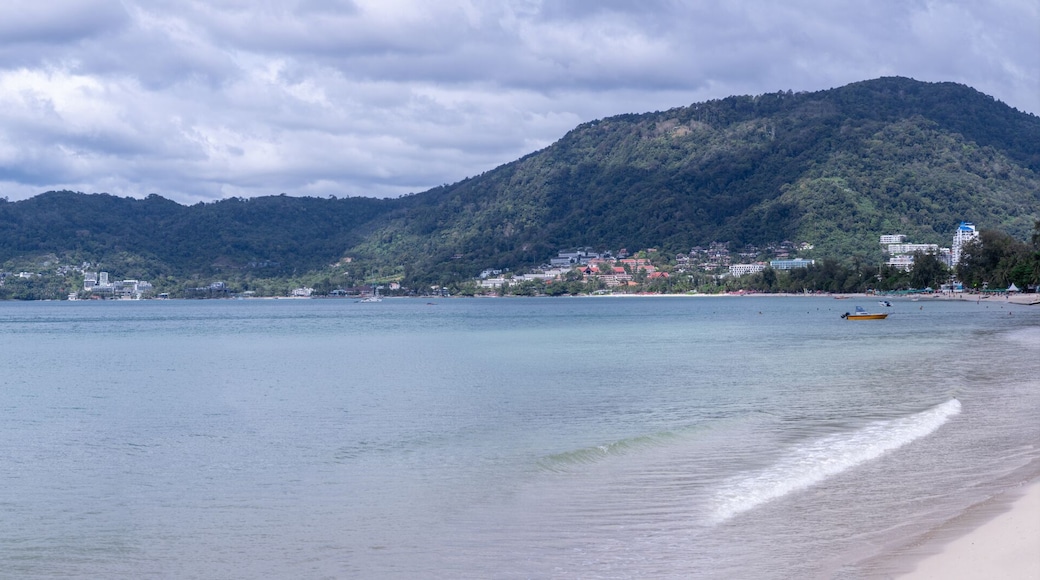 view of Patong and patong beach with the buildings and high-rise hotels and resorts in the background Kathu phuket Thailand