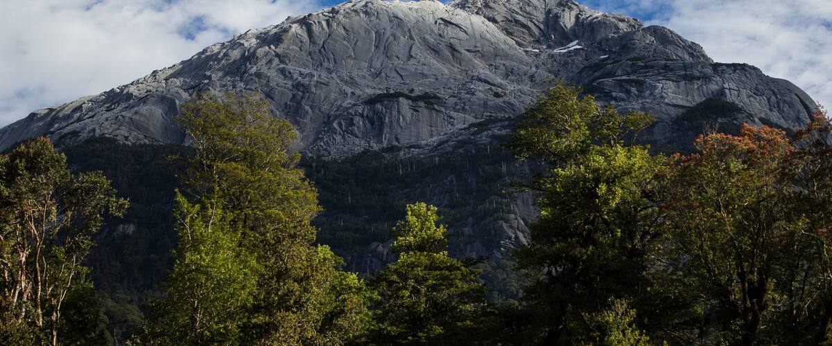 A rugged mountain with a clear sky.