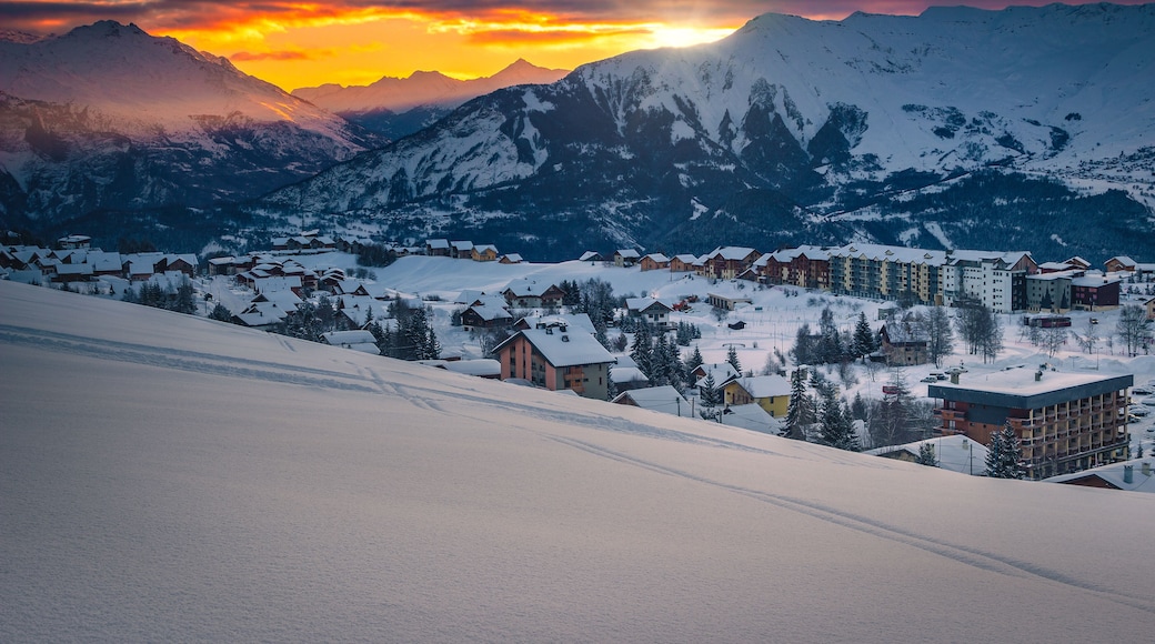 Ski resort with deep snow at sunrise, La Toussuire, France