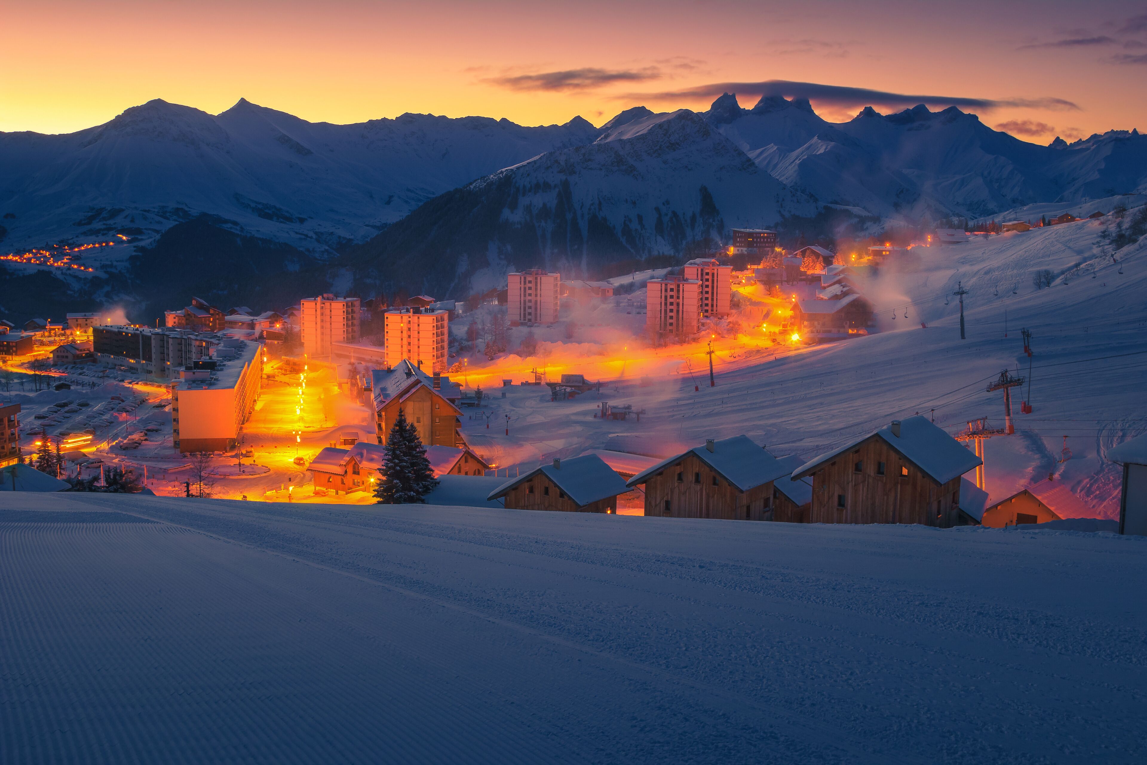 Majestic ski resort with dawn lights, La Toussuire, France