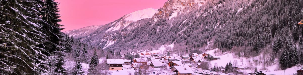 Cityscape of the town of Chatel in the Portes du Soleil in France on a pink morning. HDR