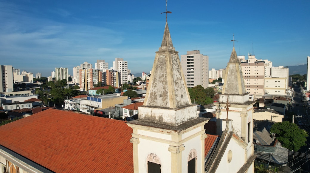 Aerial view of Nossa Senhora do Rosario Church in Taubate, Brazil, 18th century historic colonial church under sunny blue sky