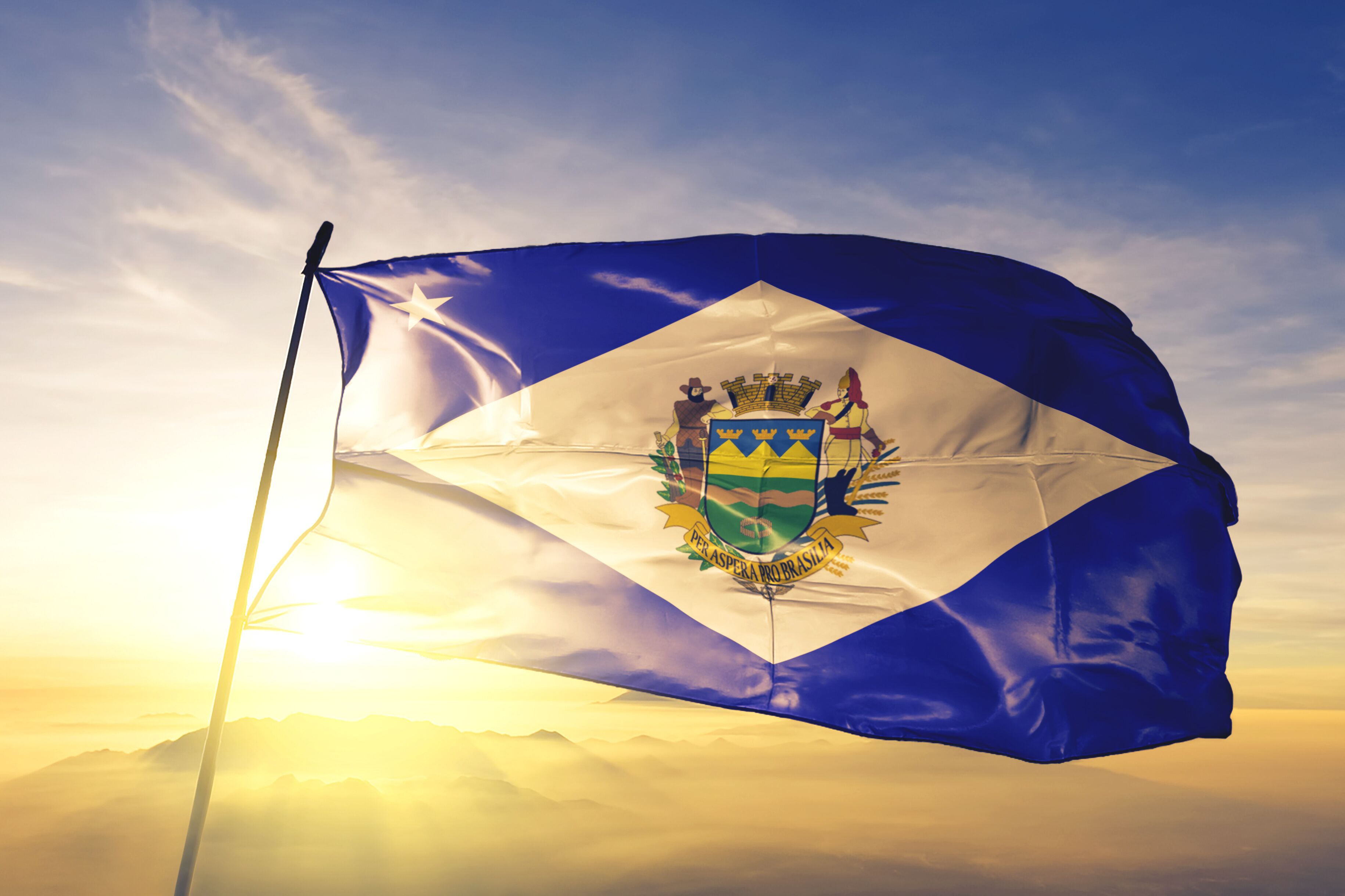 Taubate of Brazil flag waving on the top sunrise mist fog