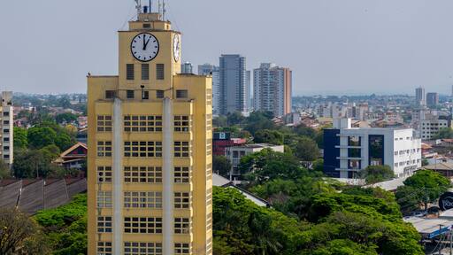 view of the city of taubaté with emphasis on a building with clock