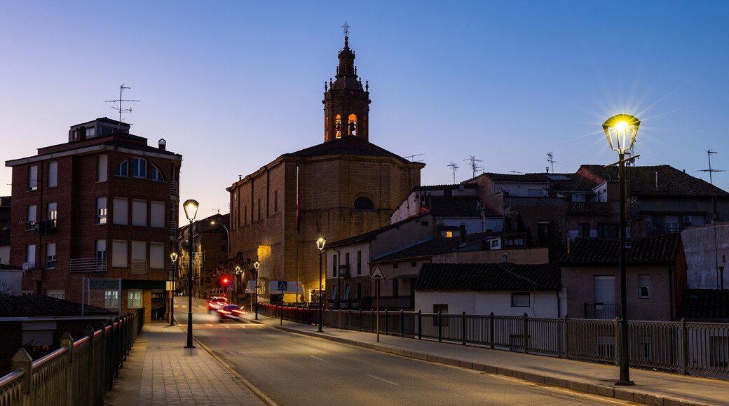 Deserted streets of ancient city Cenicero in province of Rioja, northeastern Spain. Soft evening light of lanterns illuminates narrow stone bridges of town Cenicero