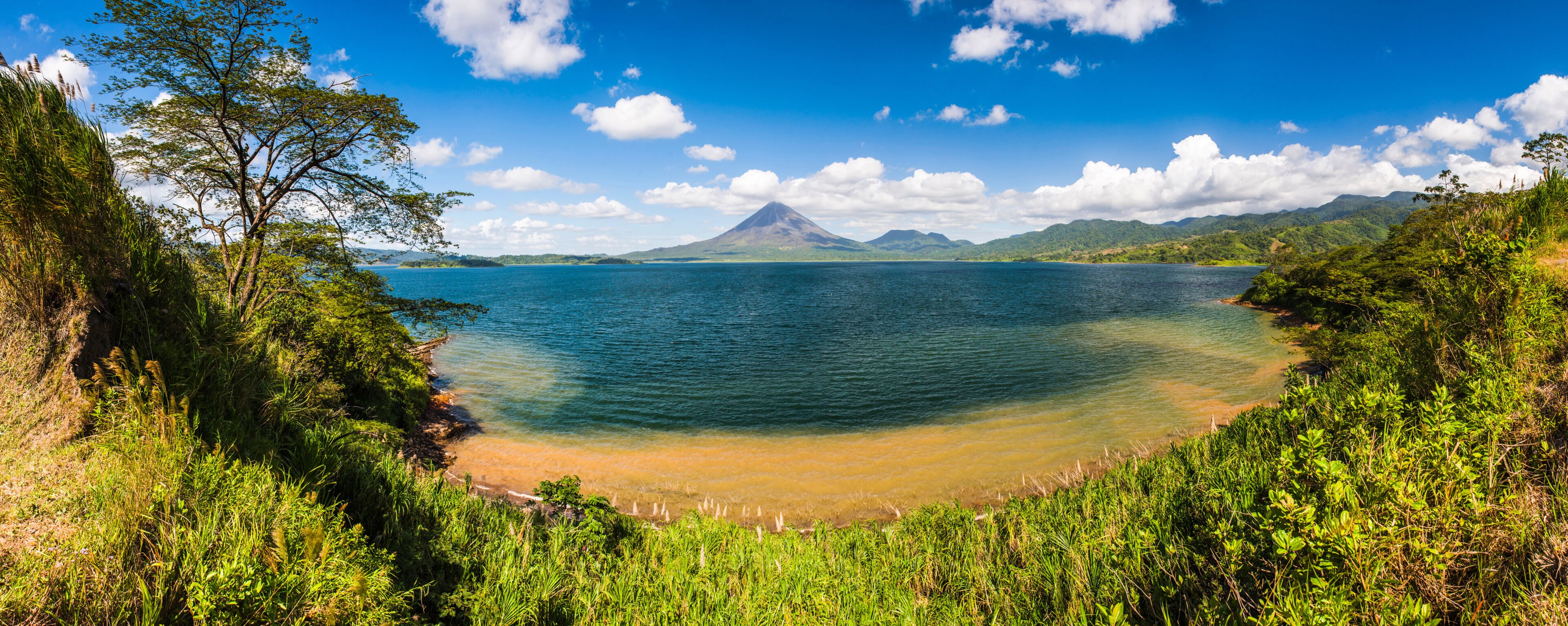 Arenal Volcano behind Laguna de Arenal (Arenal Lake)