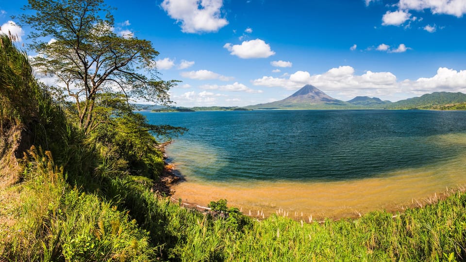 Arenal Volcano behind Laguna de Arenal (Arenal Lake)