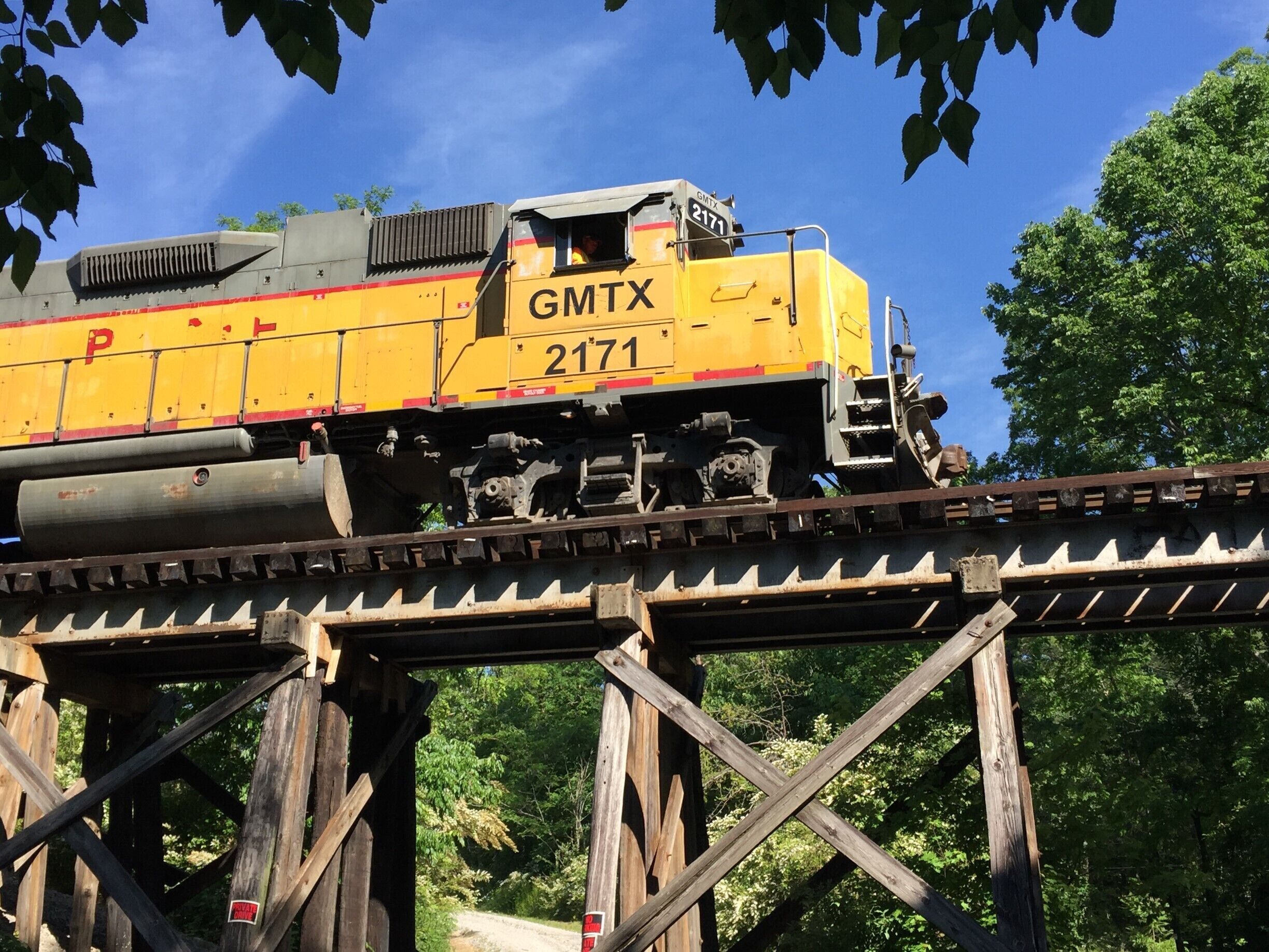There is an old wooden train trestle across the road from where you park to visit Ozone Falls. I came back at just the right time to capture this photo.