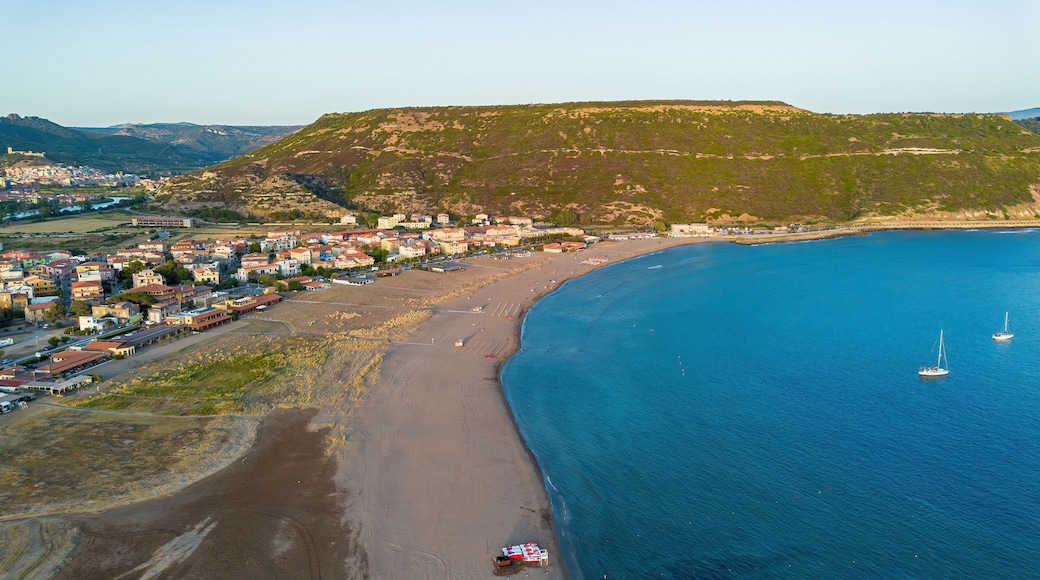 Aerial view of Bosa Marina beach and sailboats at sunset in Sardinia, Italy
