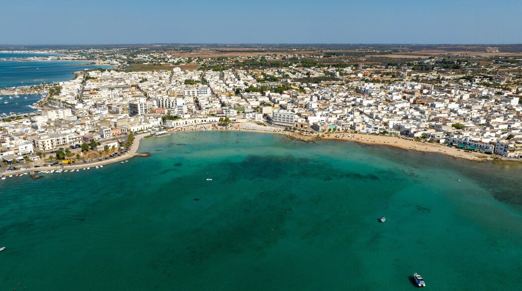 Aerial view Porto Cesareo, a small city on the Mediterranean Sea in the province of Lecce in Puglia, Italy. It is a tourist town located on the Ionian coast of the Salento peninsula.