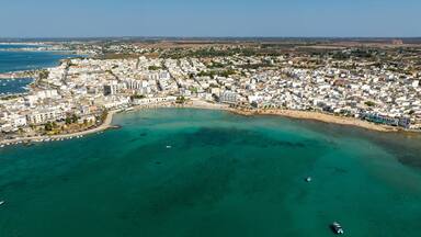 Aerial view Porto Cesareo, a small city on the Mediterranean Sea in the province of Lecce in Puglia, Italy. It is a tourist town located on the Ionian coast of the Salento peninsula.