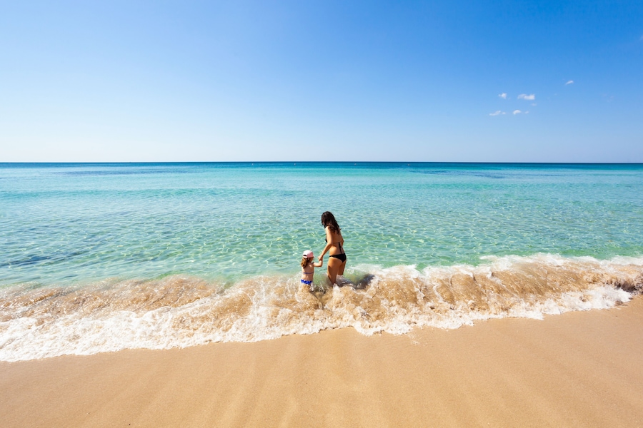 Beautiful sea with turquoise water and golden beach in Salento.