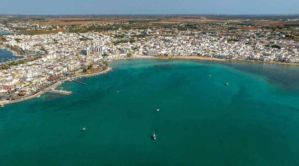 Aerial view Porto Cesareo, a small city on the Mediterranean Sea in the province of Lecce in Puglia, Italy. It is a tourist town located on the Ionian coast of the Salento peninsula.