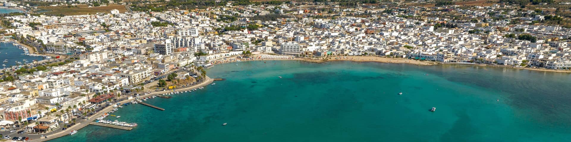 Aerial view Porto Cesareo, a small city on the Mediterranean Sea in the province of Lecce in Puglia, Italy. It is a tourist town located on the Ionian coast of the Salento peninsula.