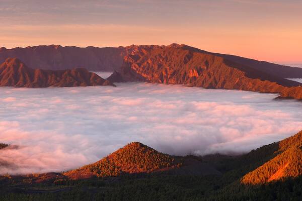 Cumbre Nueva and Cumbre Vieja mountains at sunset above clouds, La Palma, Canary Islands, Spain, Europe