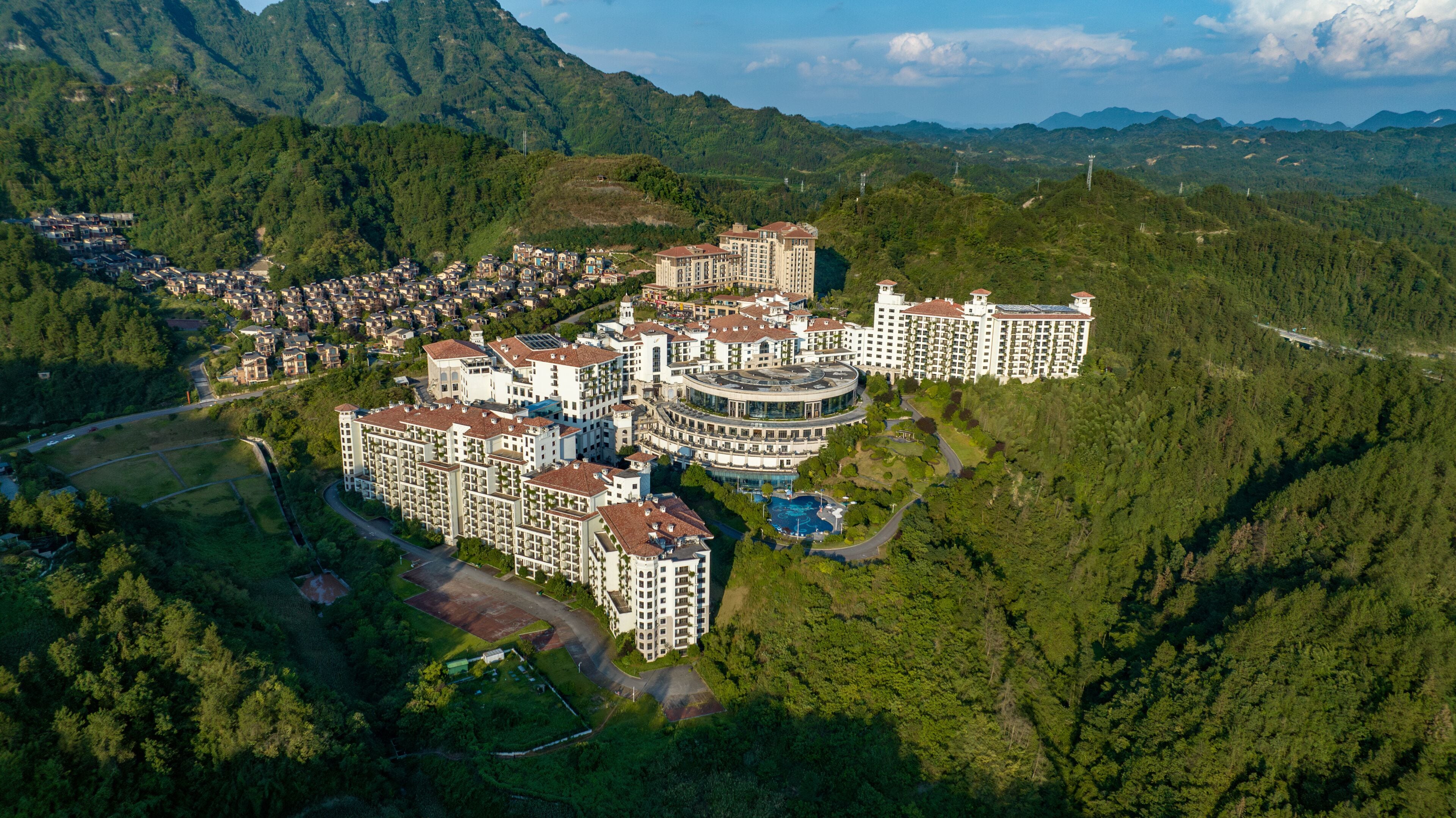 Aerial view of a hotel complex, golden hour in Zhangjiajie, Hunan, China.
