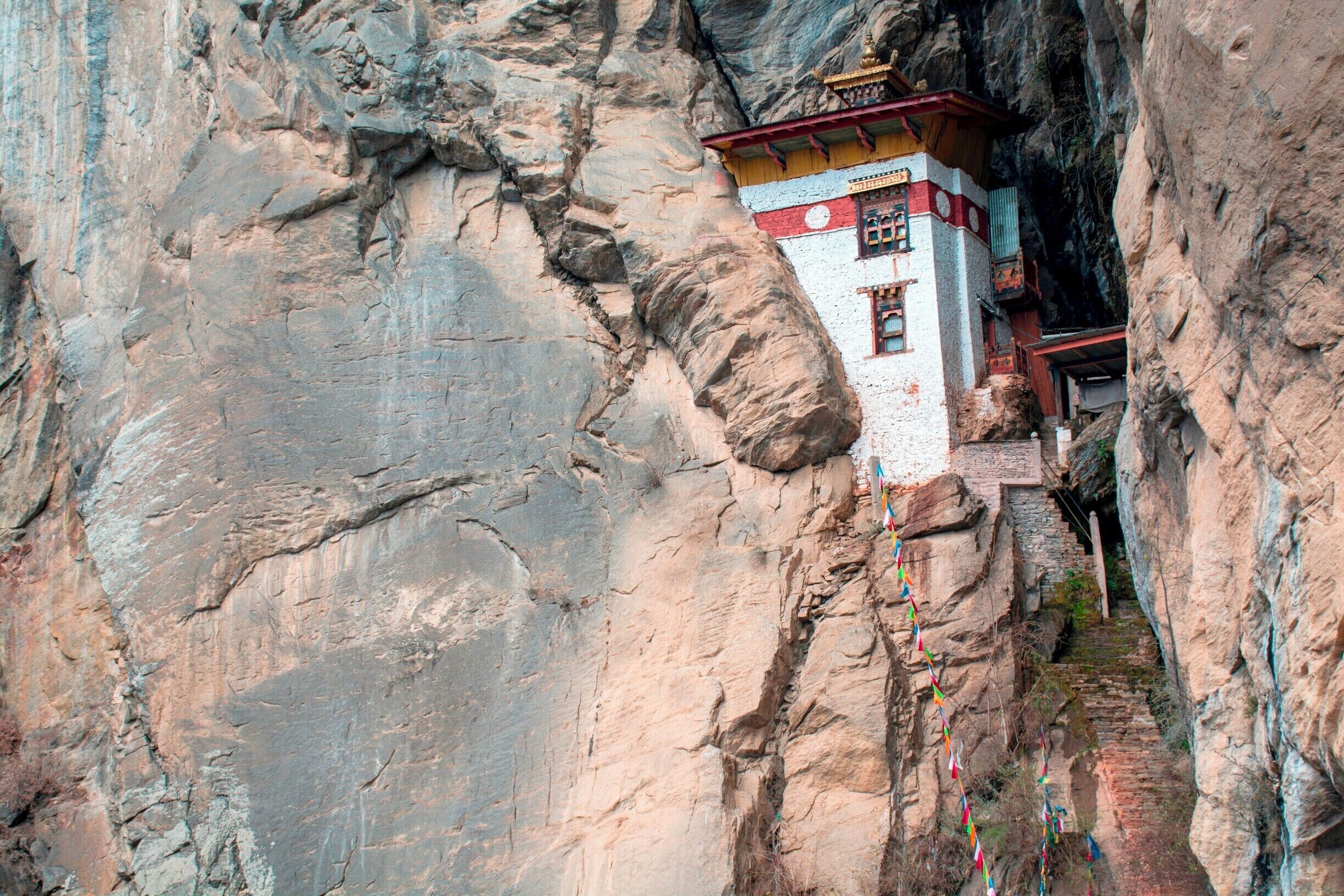 Small temple built into the rocks, near the Tiger's Nest, or Taktsang Monastery, Paro, Bhutan.