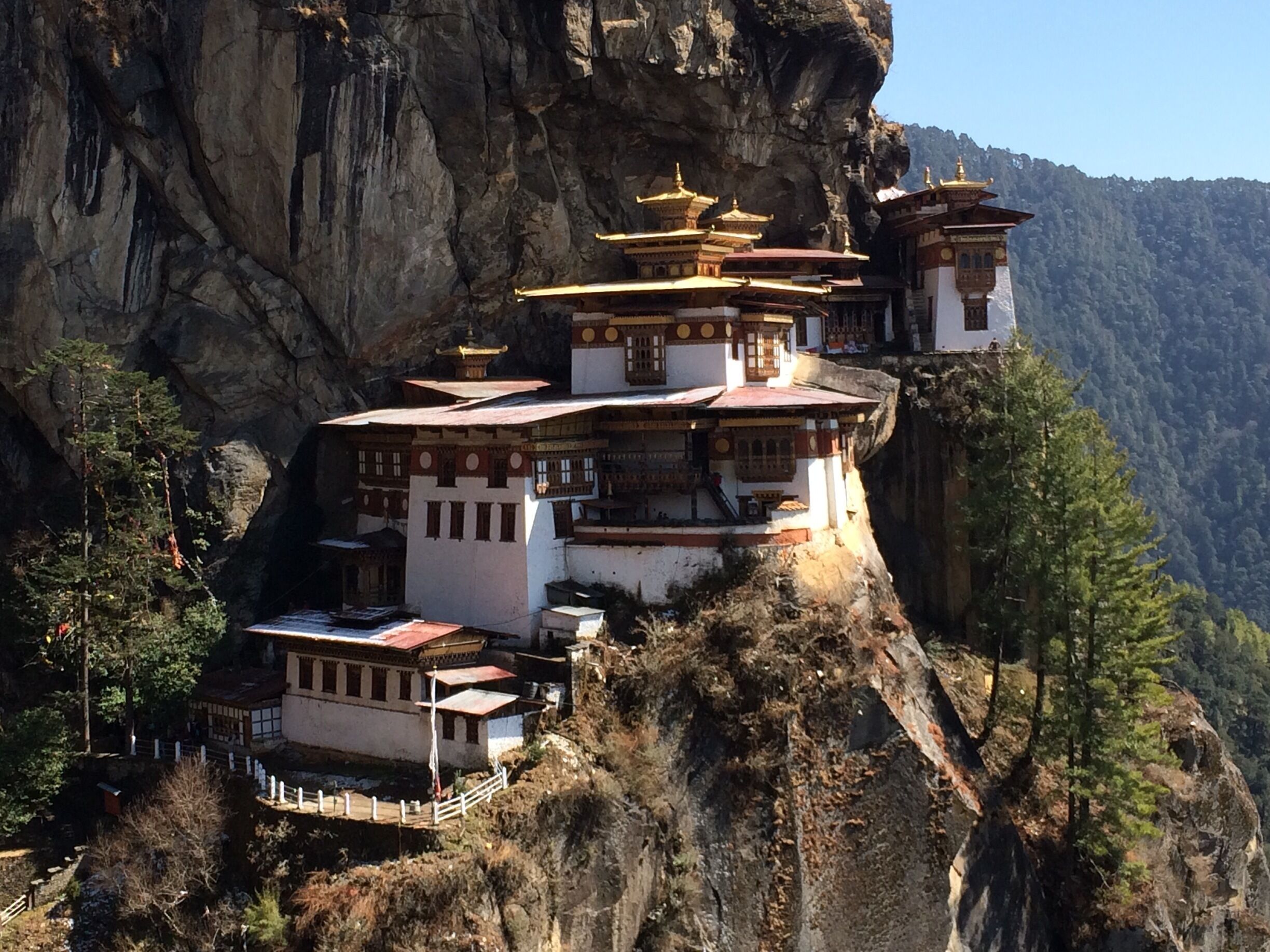 Paro Taktsang or popularly known as "Tiger's Nest" is a prominent Himalayan Buddhist sacred site and temple complex, located in the cliffside of the upper Paro valley, in Bhutan. A temple complex was first built in 1692, around the Taktsang Senge Samdup (stag tshang seng ge bsam grub) cave where Guru Padmasambhava is said to have meditated for three years, three months, three weeks, three days and three hours in the 8th century. It can be accessed by a mere 3hr uphill hike or can have an alternate option of a pony ride up. The Monastery is closed bet 1-2pm for the Monk's observed lunch. The view of the monastery changes constantly depending on which part of the trek you are at. #architecture