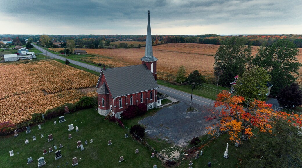 Cold air landscapes of rural scenes depicting barns and abandoned homes in fall colour settings around the South East of Ontario Canada in The Greater Napanee and Stone Mills township.