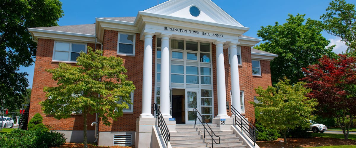A brick building with a white pediment and columns, labeled "Burlington Town Hall Annex."