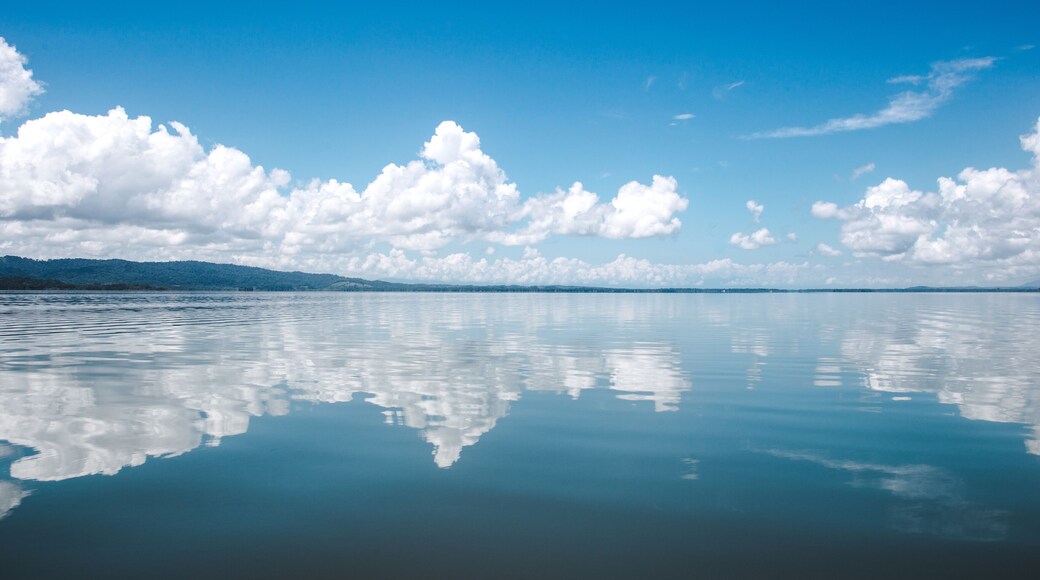 Beautiful tranquility of the calm, smooth water on the lake at El Golfete, in between Rio Dulce and Livingston in Guatemala