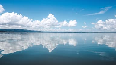 Beautiful tranquility of the calm, smooth water on the lake at El Golfete, in between Rio Dulce and Livingston in Guatemala