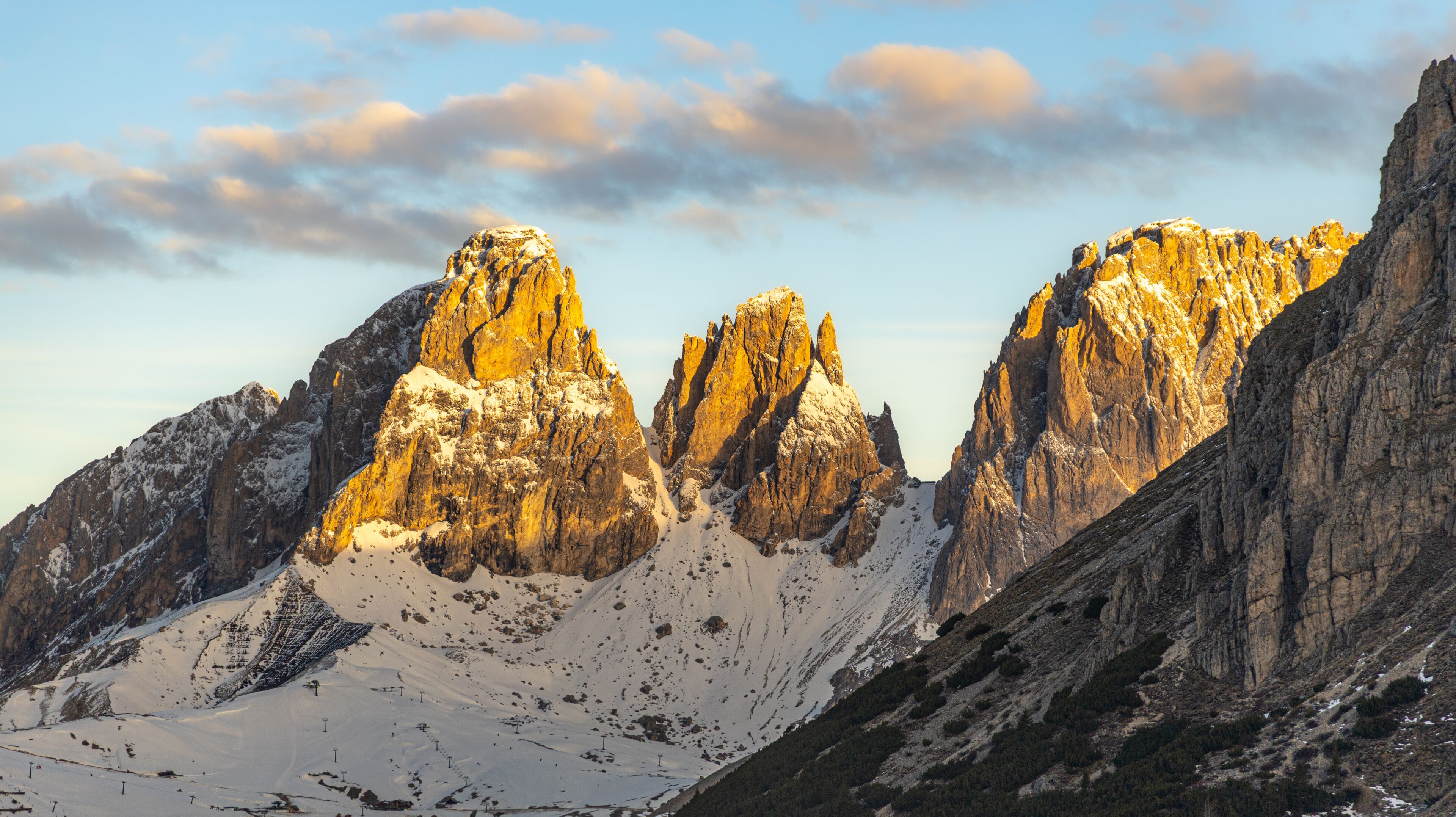 Rugged mountains with sharp peaks and snow-covered slopes.