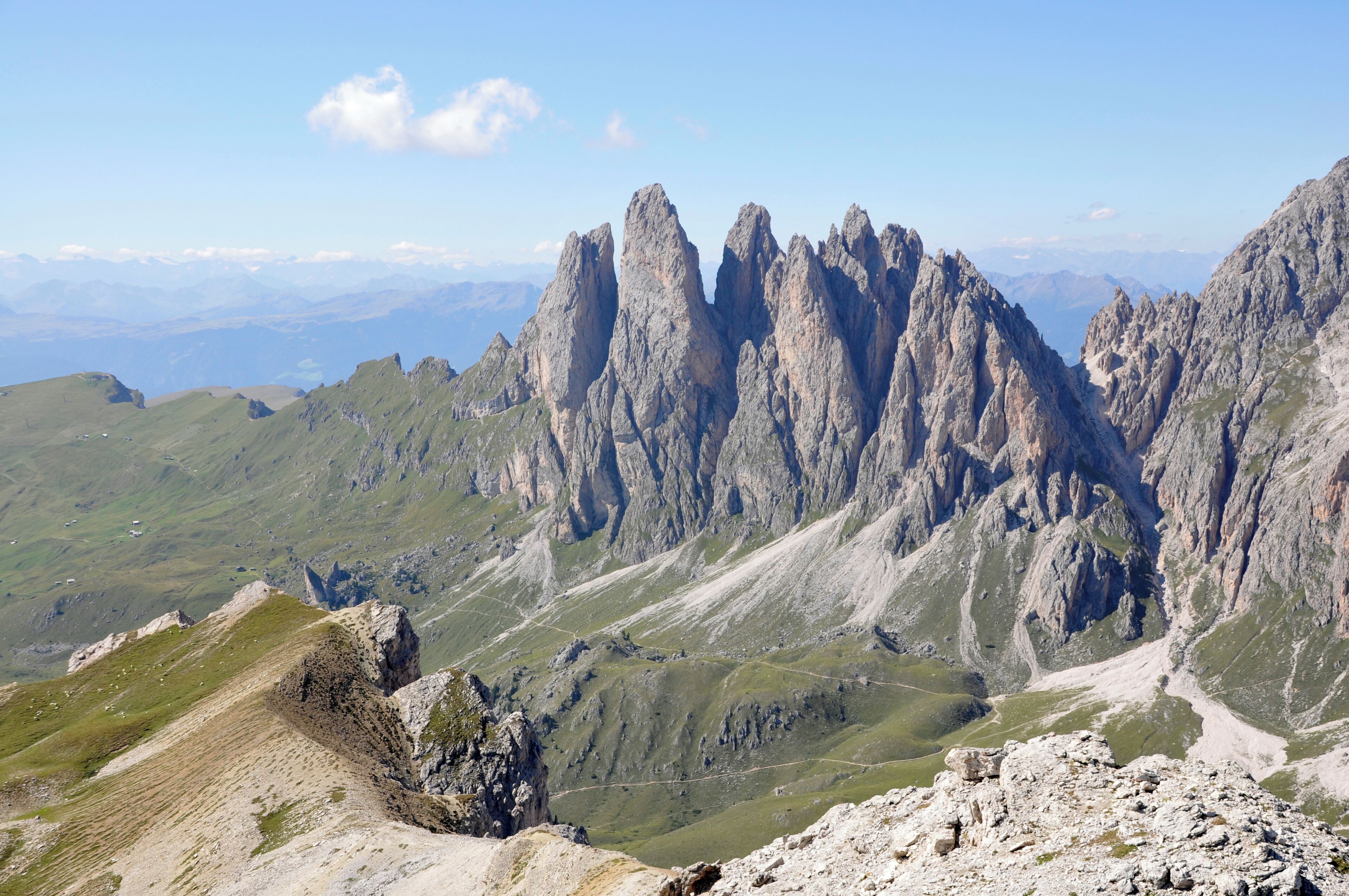 A mountainous landscape with rugged peaks and a clear sky.