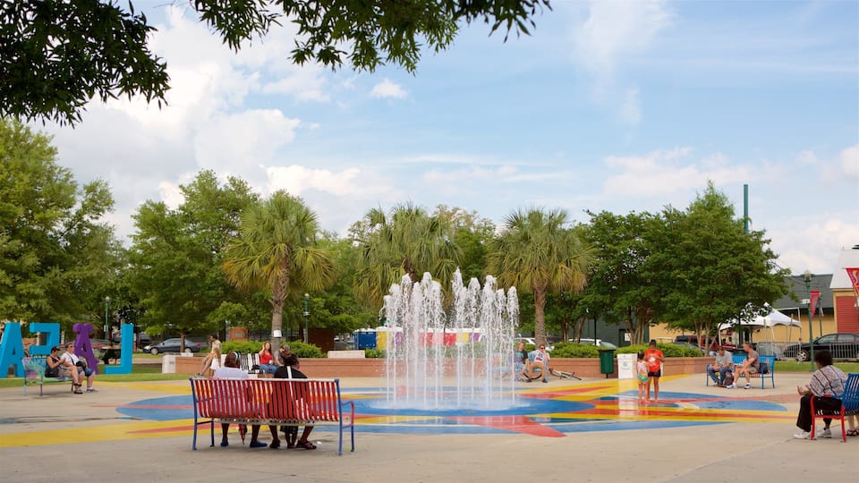 Lafayette showing a park and a fountain as well as a small group of people