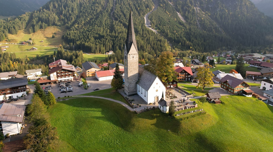Scenic aerial photography of the village of Mittelberg, Austria with focus on its picturesque church