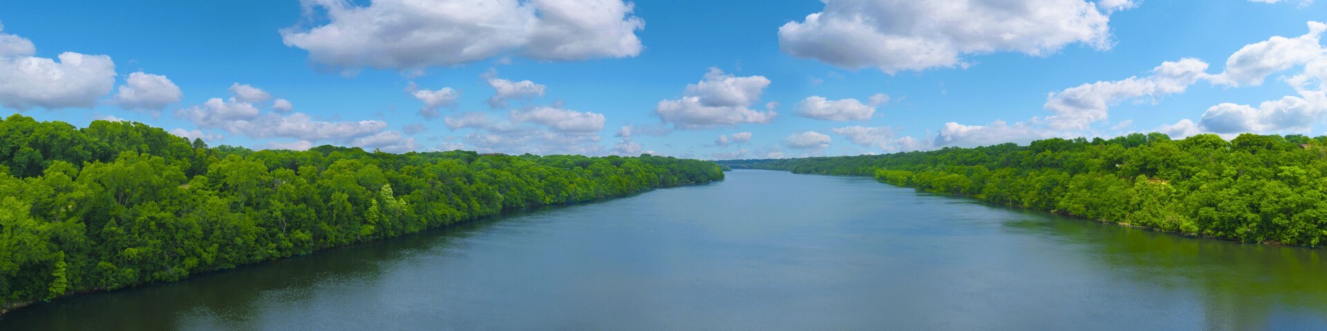 The Big Mississippi river panorama with blue sky and white clouds