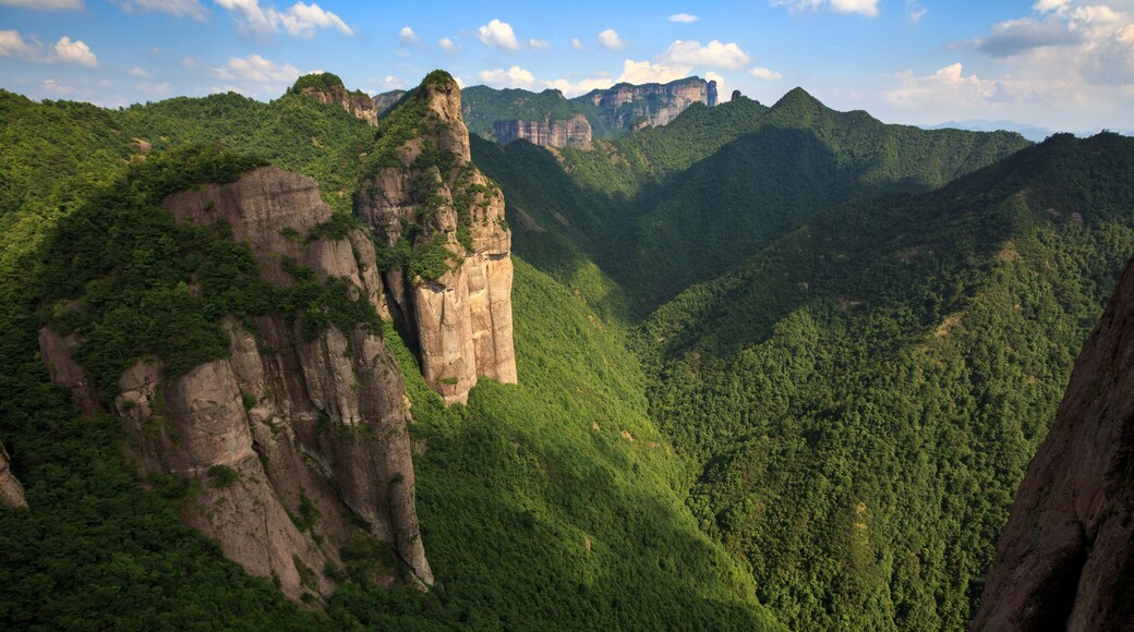 Shenxianju Scenic Area - Xianju County, Taizhou, Zhejiang Province China. Known as the "Place Where Spirits Reside", Chinese Canyon Scenery with steep cliffs, aerial view above green forests below