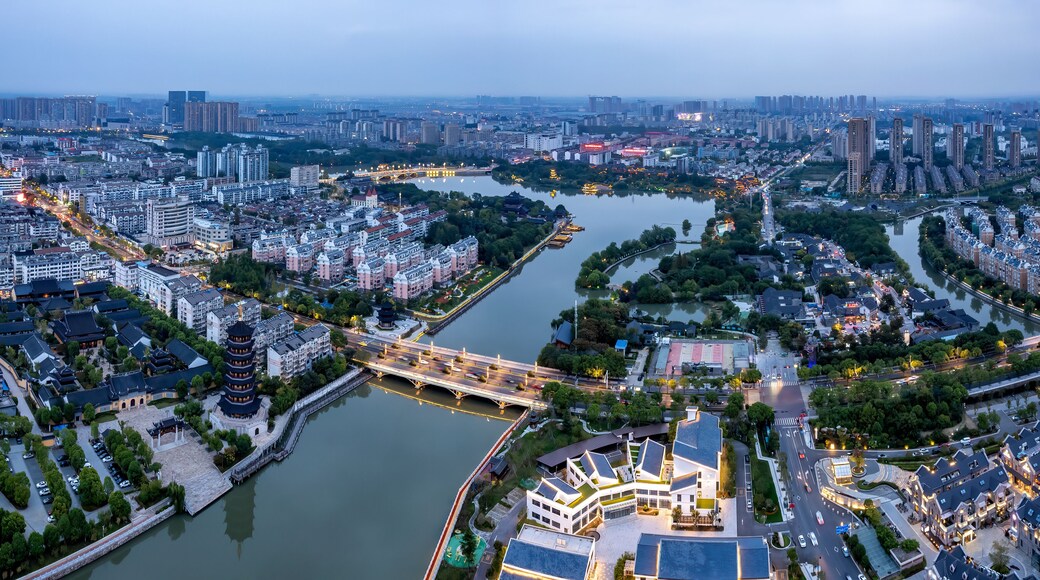 Aerial photography night view of Taizhou city skyline in China