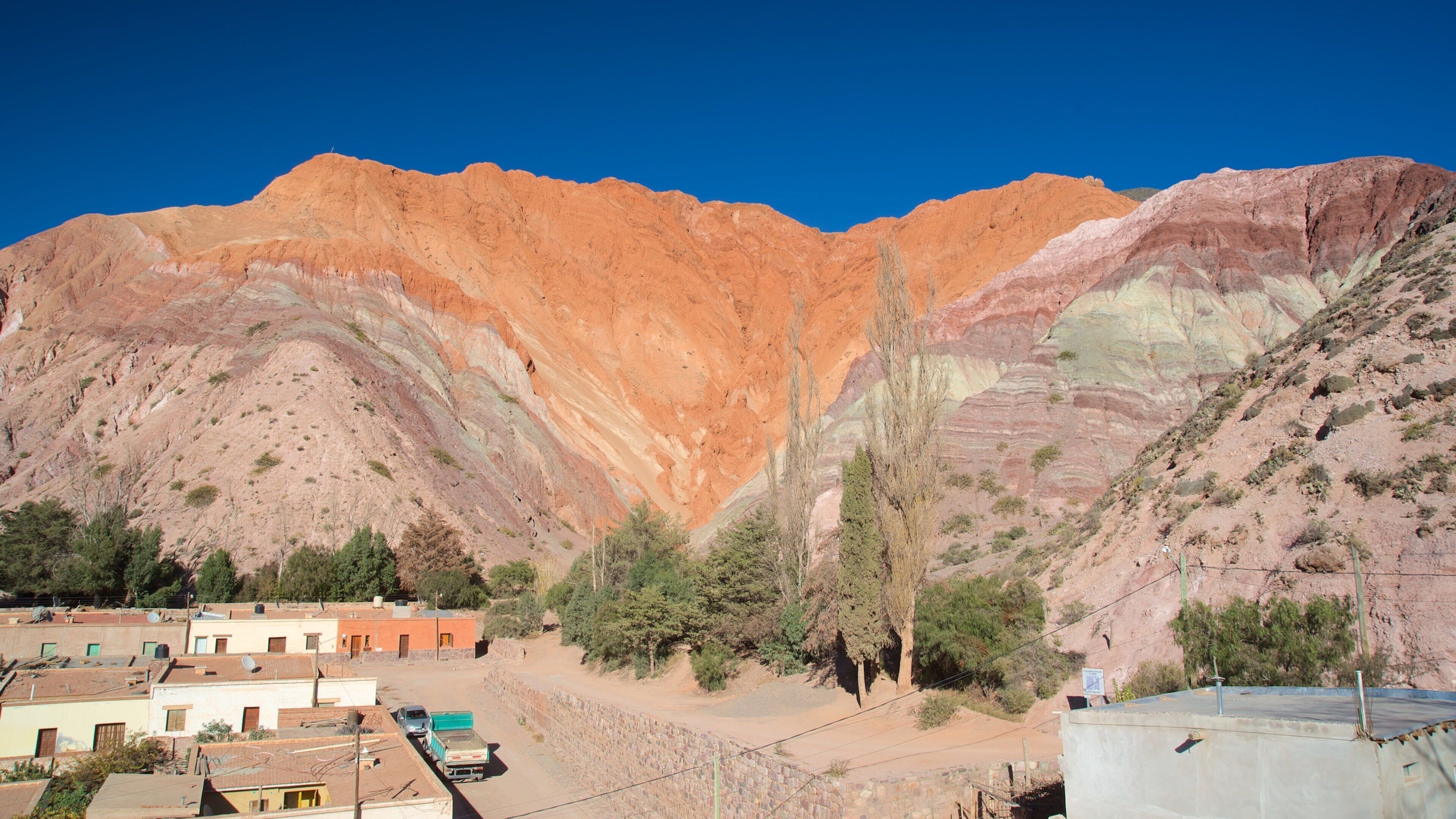 A mountainous landscape with a clear blue sky.