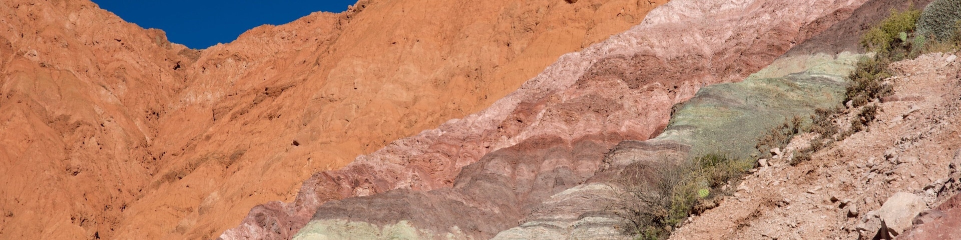 Purmamarca which includes mountains and desert views