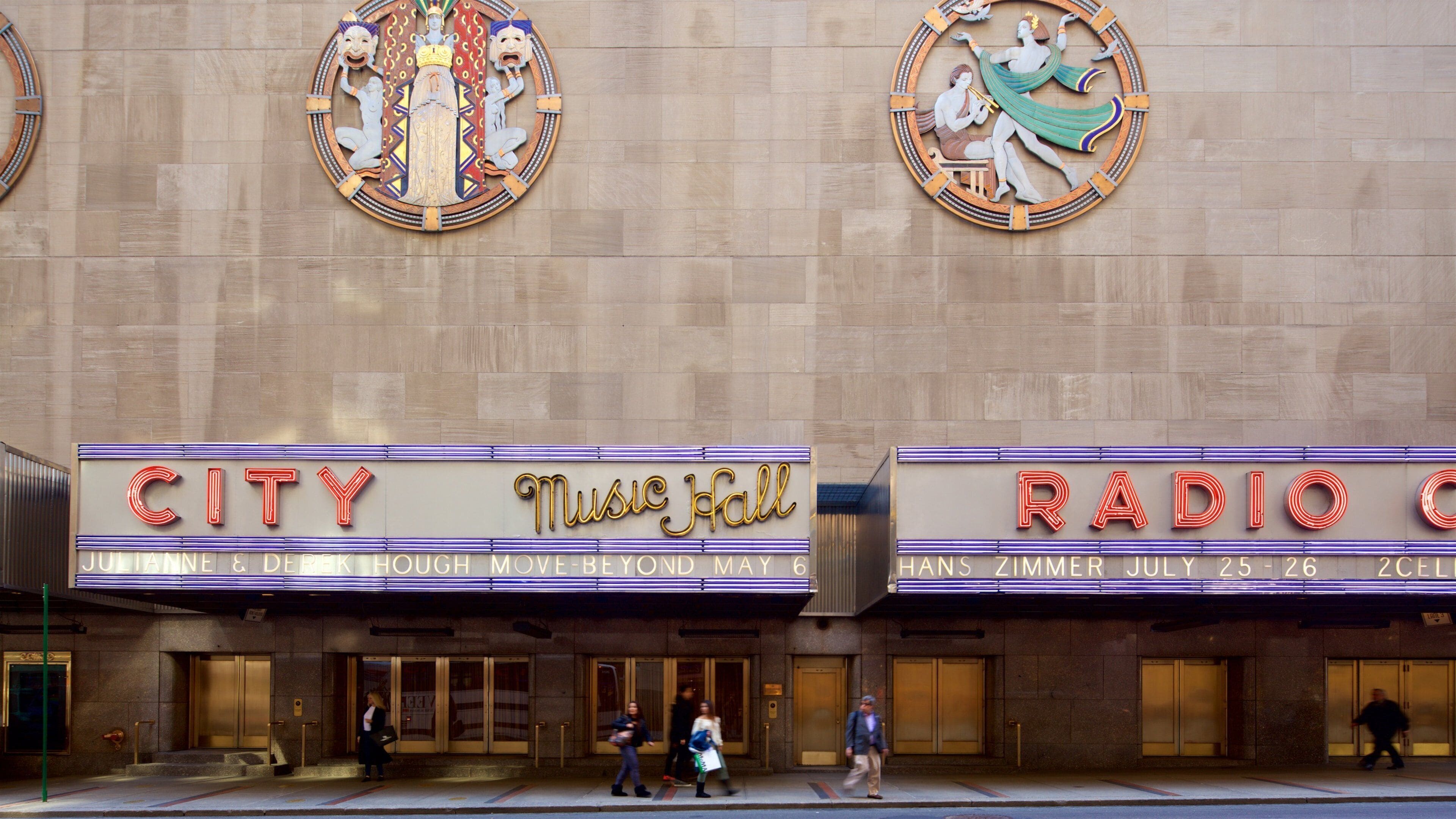 Radio City Music Hall showing signage and a city